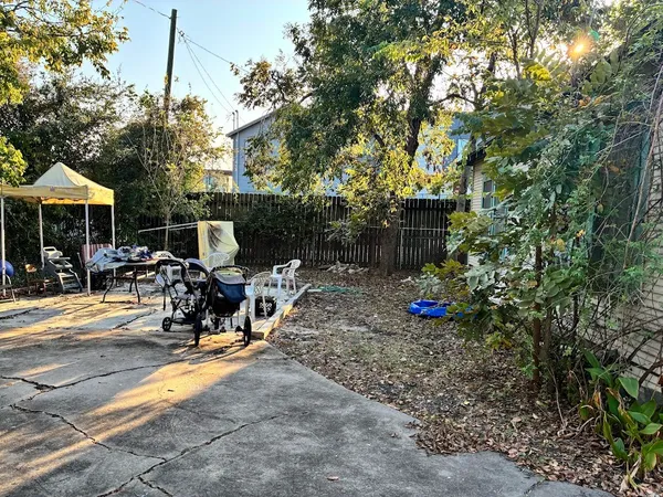 a view of a patio with table and chairs and potted plants