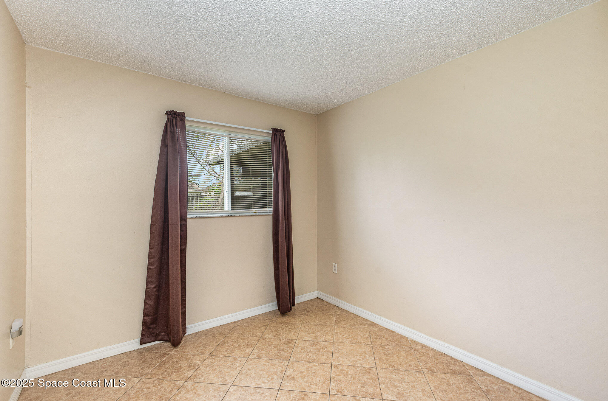 5930 Ackard Avenue Cocoa, FL 32927 - Photo 16 of 22 a view of an empty room with windows