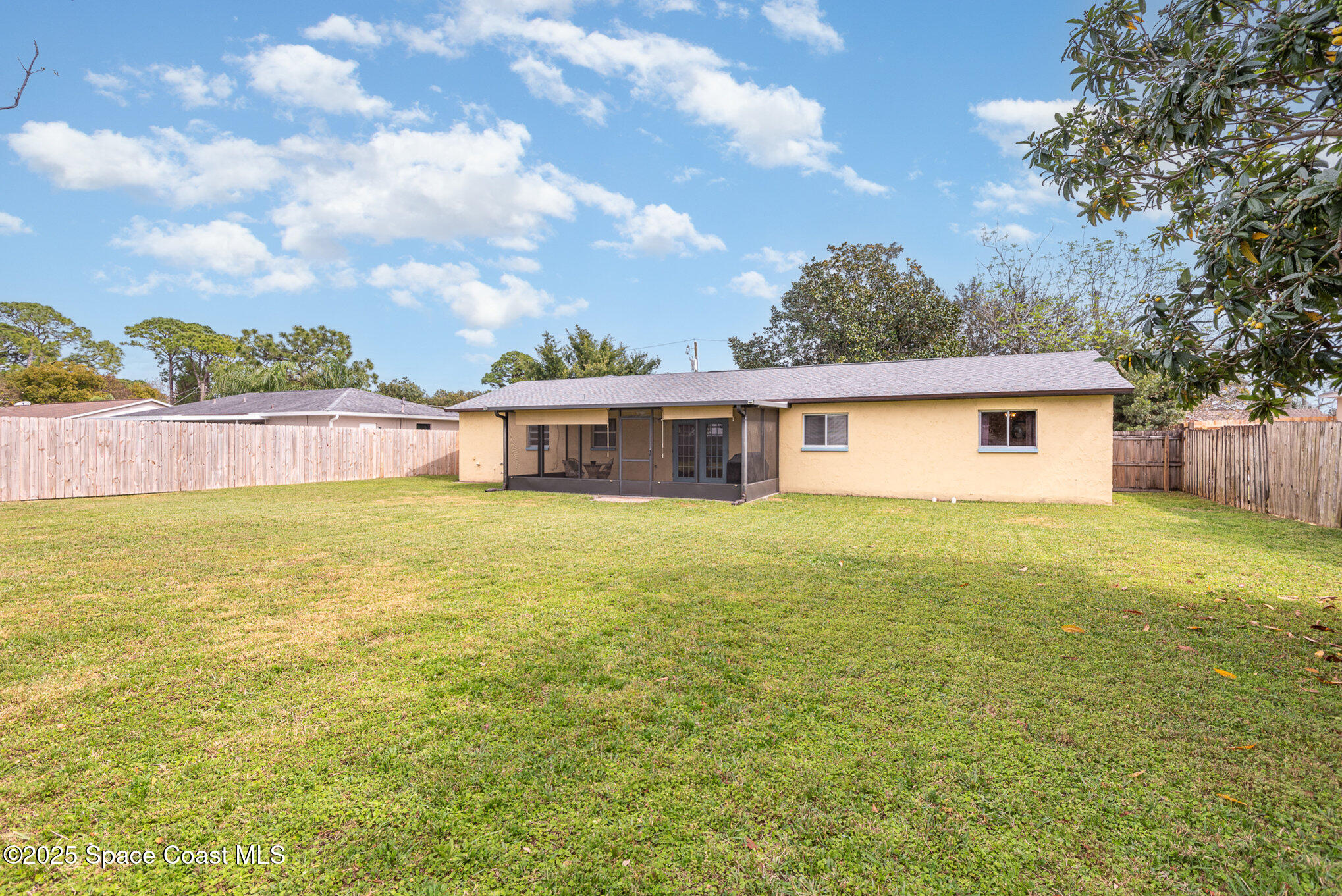 5930 Ackard Avenue Cocoa, FL 32927 - Photo 19 of 22 a front view of house with yard and lake view in back