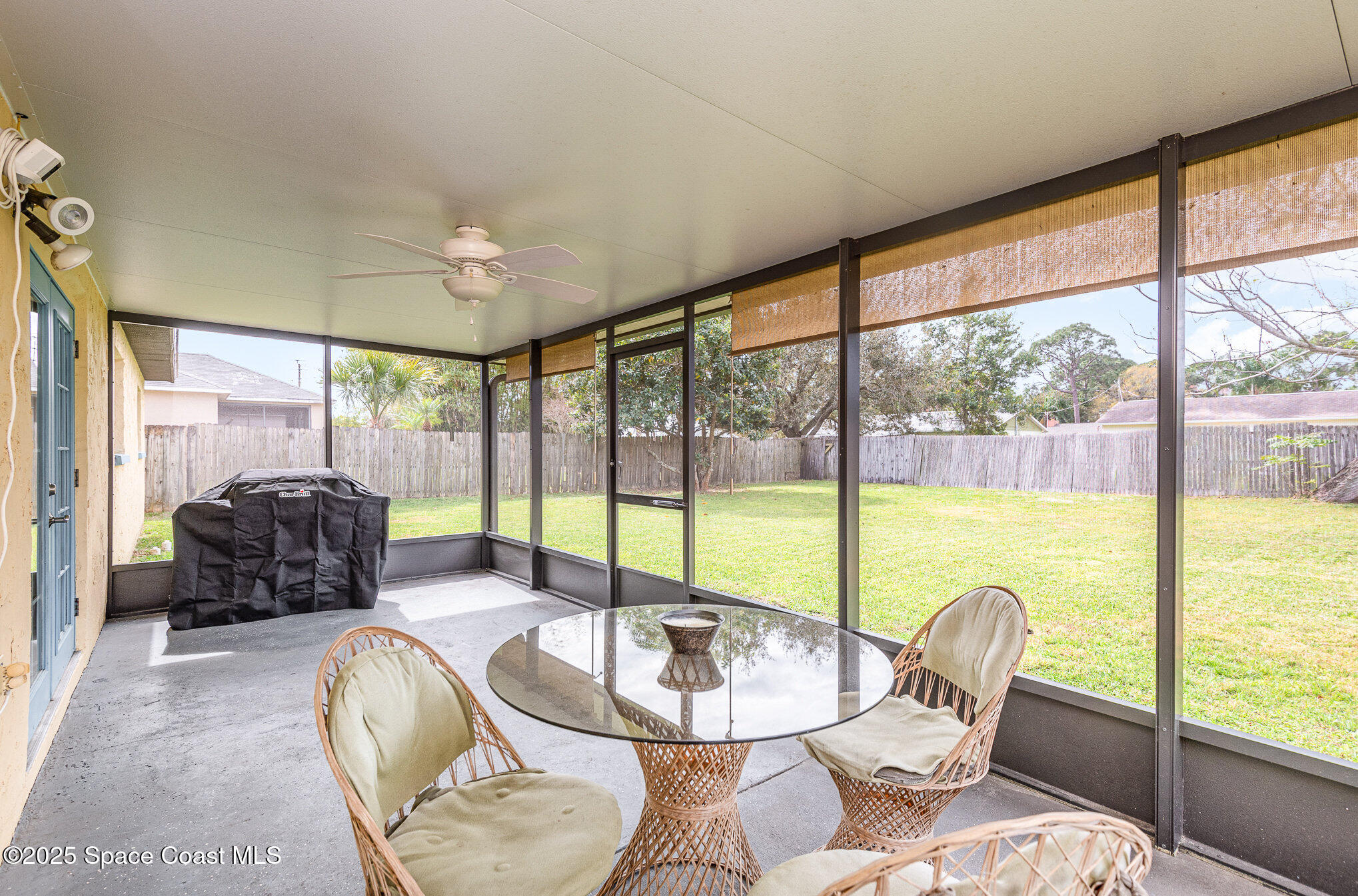 5930 Ackard Avenue Cocoa, FL 32927 - Photo 10 of 22 a living room with furniture and a floor to ceiling windows
