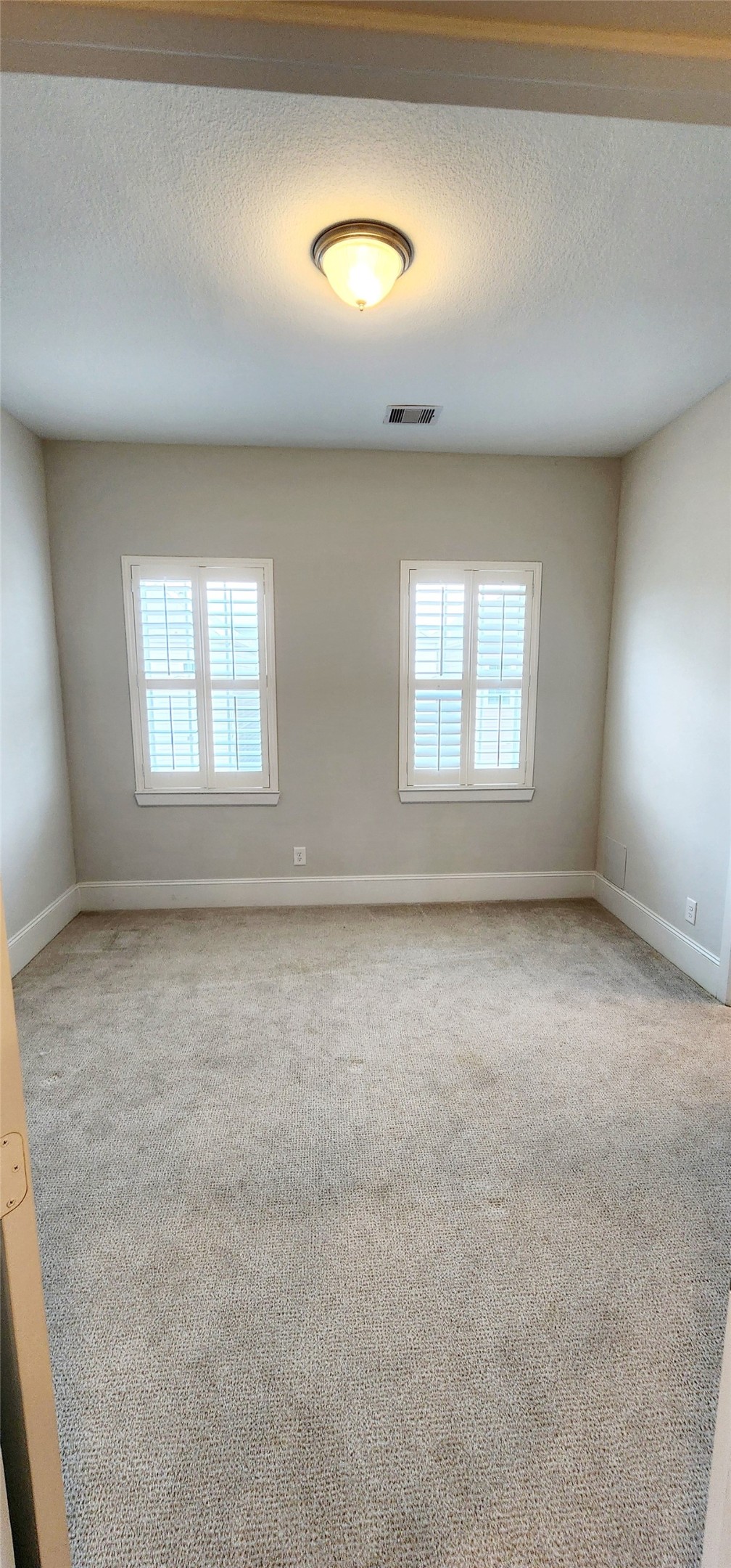 11 West Rafters Row The Woodlands, TX 77380 - Photo 21 of 31 an empty room with a empty space and windows