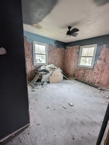 a workspace with furniture and window