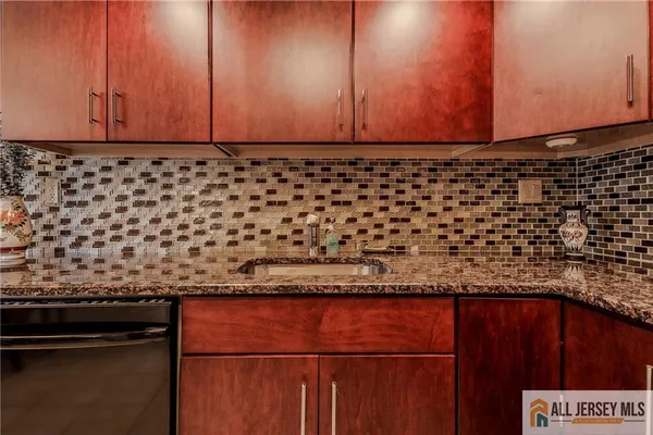 a view of a sink and cabinets
