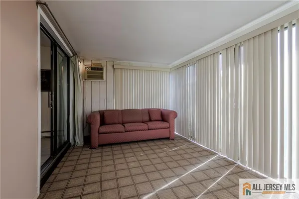a living room with a couch and a window