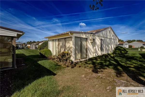 a view of a back yard of the house