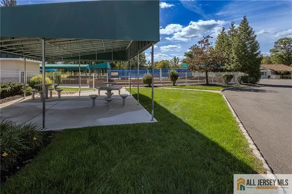 a view of a backyard with sitting area