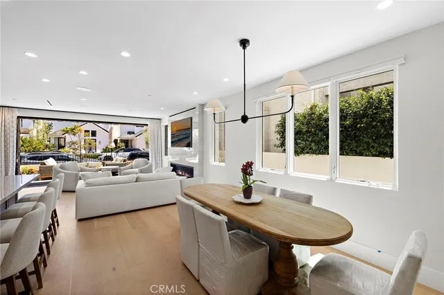 a very nice looking dining room with a large window