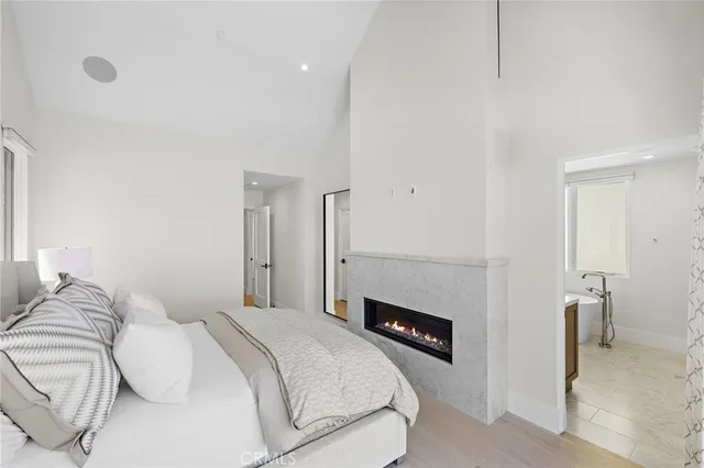 a bedroom with a bed and a couch