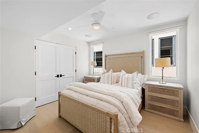 a bed room with a bed and a night stand