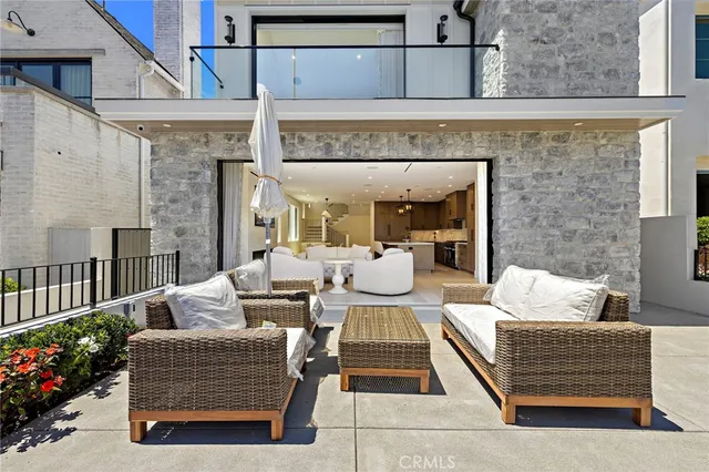 a outdoor living space with furniture and a fireplace
