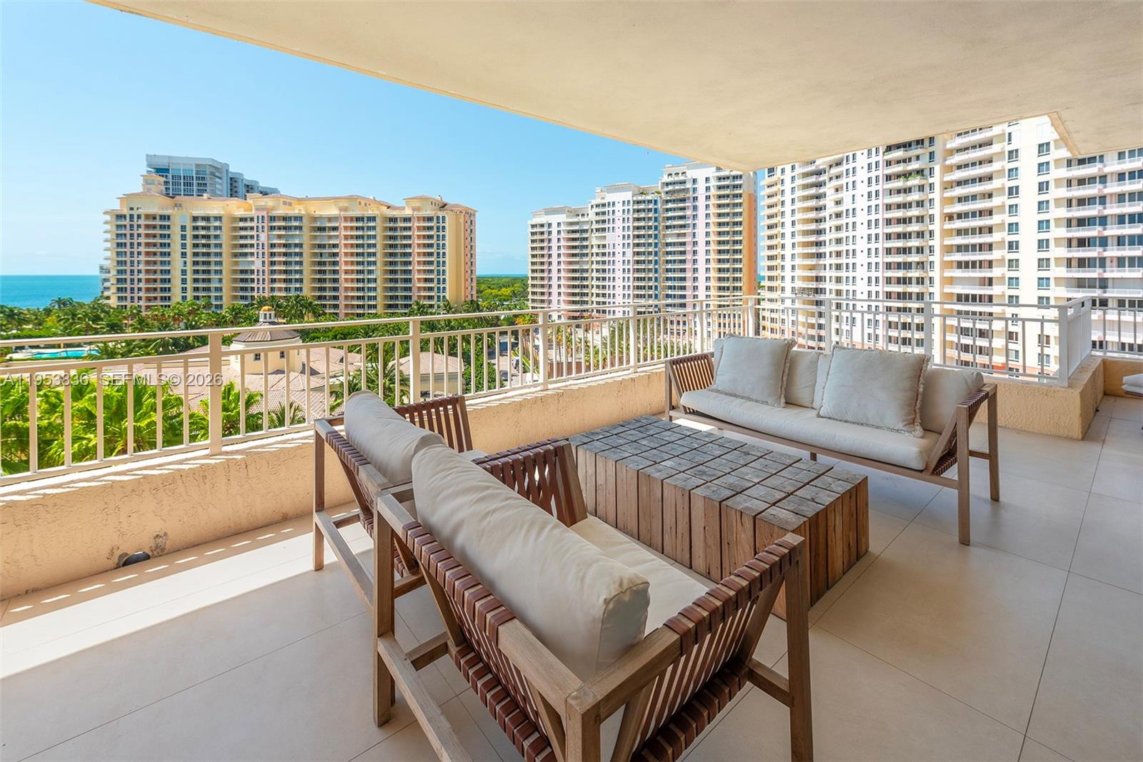 791 Crandon Boulevard, Unit 901 Key Biscayne, FL 33149 - Photo 12 of 43 a balcony with furniture and a large window