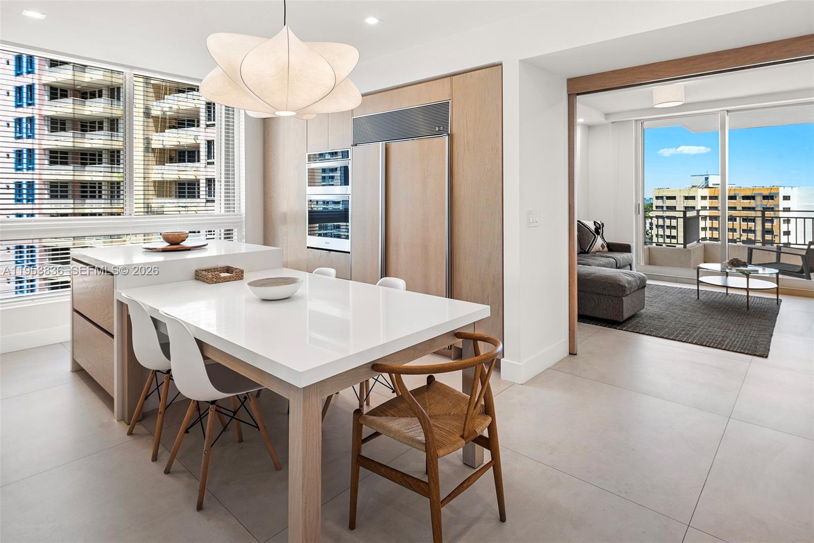 791 Crandon Boulevard, Unit 901 Key Biscayne, FL 33149 - Photo 16 of 43 a view of a dining room with furniture