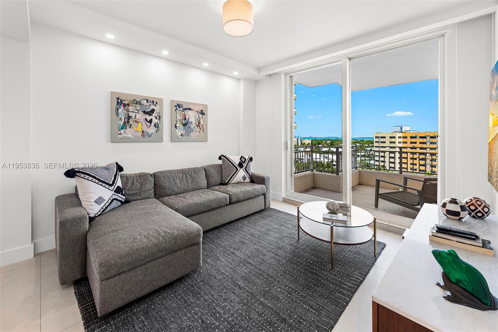 791 Crandon Boulevard, Unit 901 Key Biscayne, FL 33149 - Photo 18 of 43 a living room with furniture and a large window