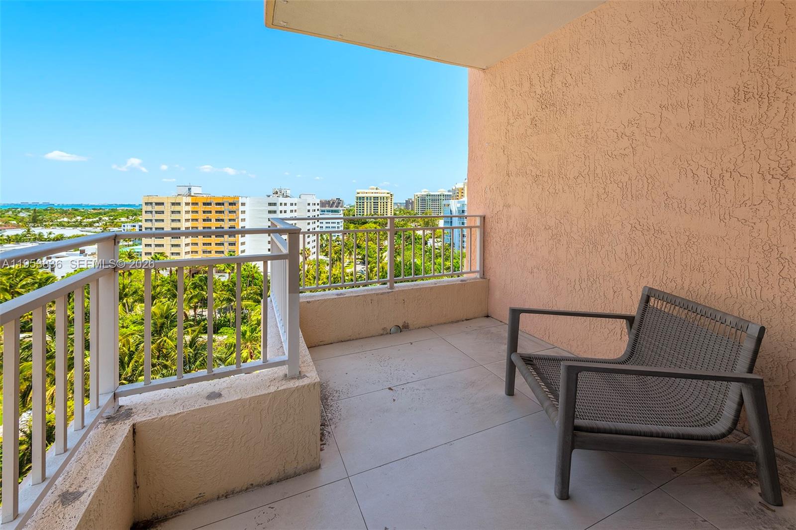791 Crandon Boulevard, Unit 901 Key Biscayne, FL 33149 - Photo 19 of 43 a view of a chairs and table in a balcony