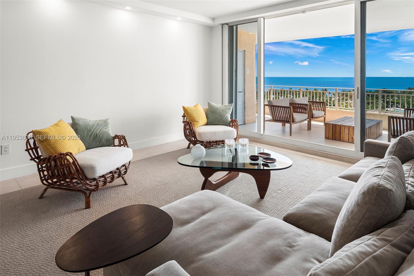 791 Crandon Boulevard, Unit 901 Key Biscayne, FL 33149 - Photo 2 of 43 a living room with furniture and a floor to ceiling window