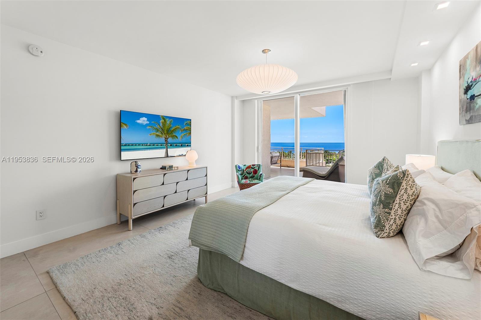 791 Crandon Boulevard, Unit 901 Key Biscayne, FL 33149 - Photo 23 of 43 a bedroom with bed a tv and a window