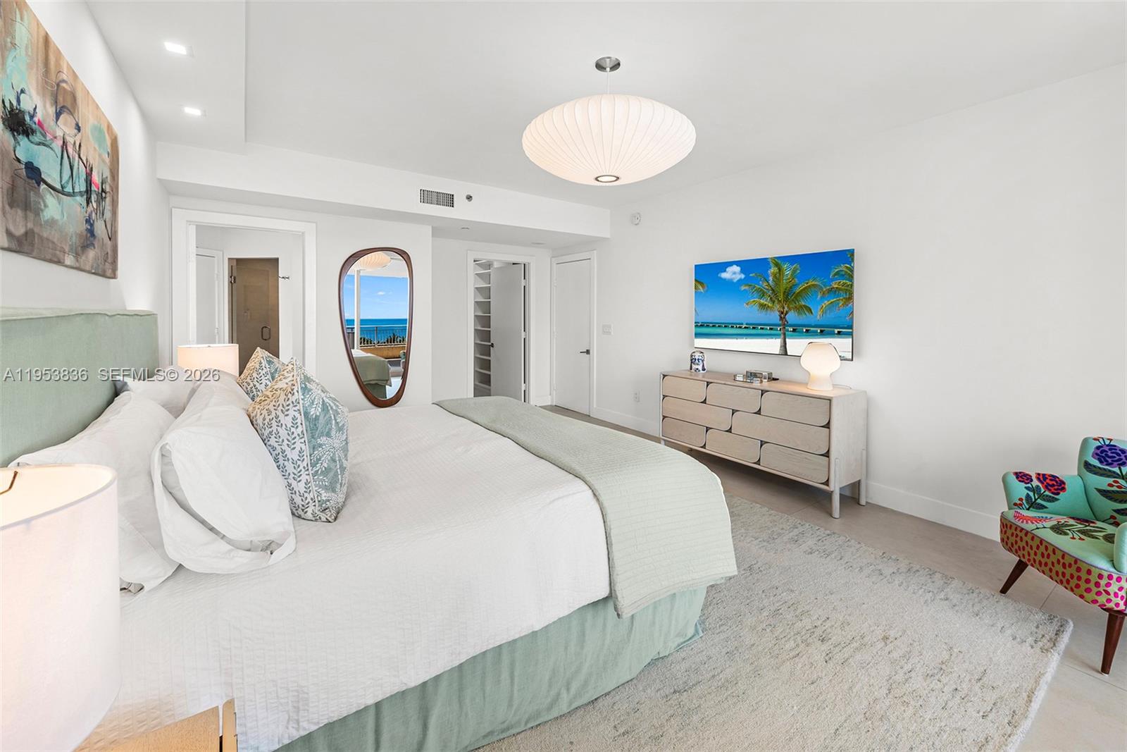791 Crandon Boulevard, Unit 901 Key Biscayne, FL 33149 - Photo 25 of 43 a large white bed in a white room