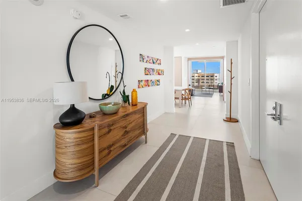 a view of a living room and entryway