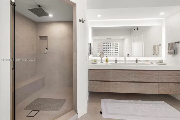 a bathroom with a sink and a mirror