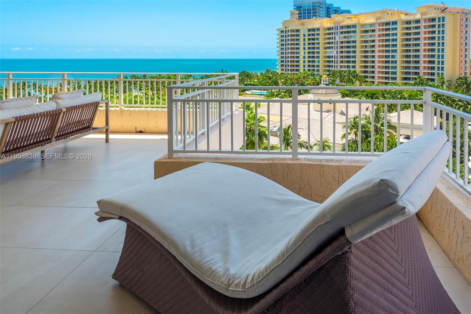 791 Crandon Boulevard, Unit 901 Key Biscayne, FL 33149 - Photo 34 of 43 a view of sitting area in balcony with wooden floor