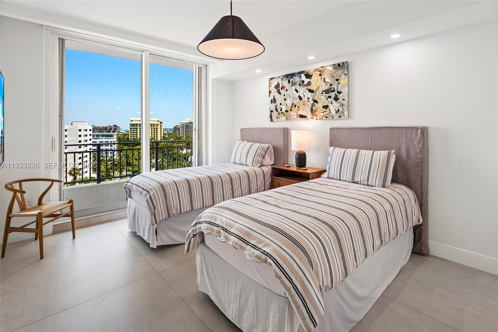 791 Crandon Boulevard, Unit 901 Key Biscayne, FL 33149 - Photo 36 of 43 a bedroom with two beds and a large window