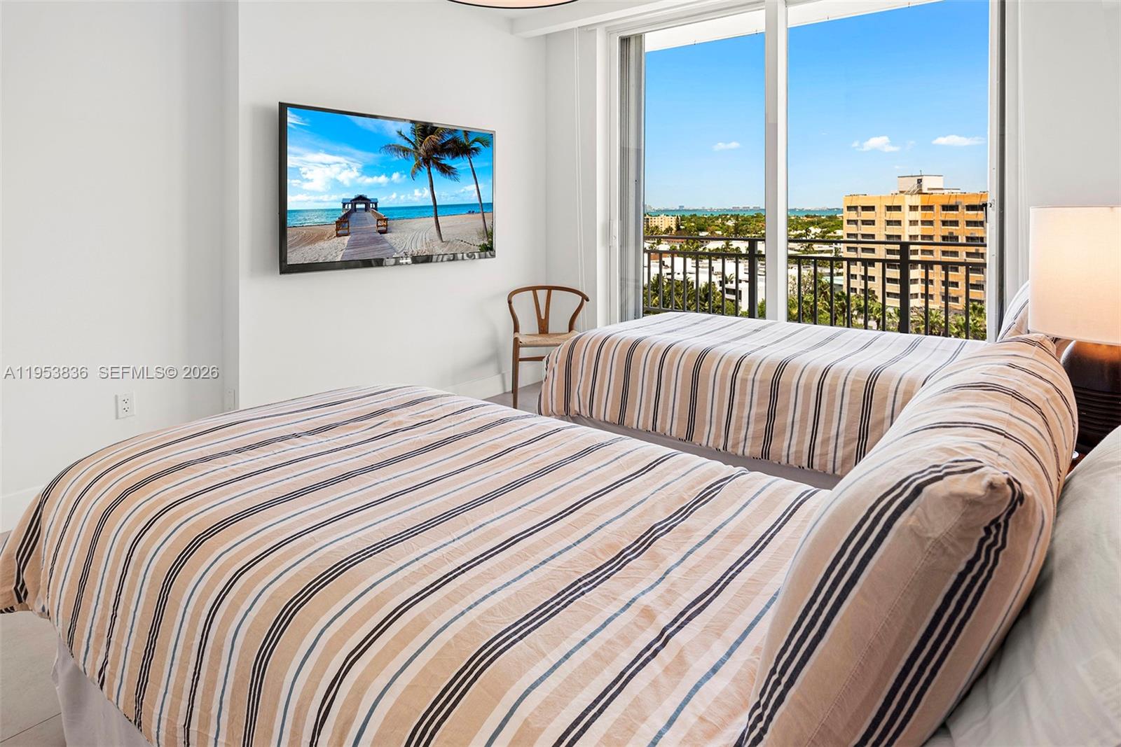 791 Crandon Boulevard, Unit 901 Key Biscayne, FL 33149 - Photo 37 of 43 a bedroom with a bed and a large window