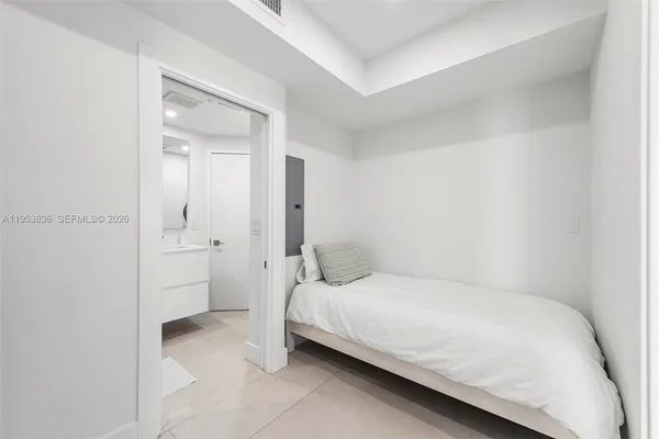 a bedroom with a bed and a closet