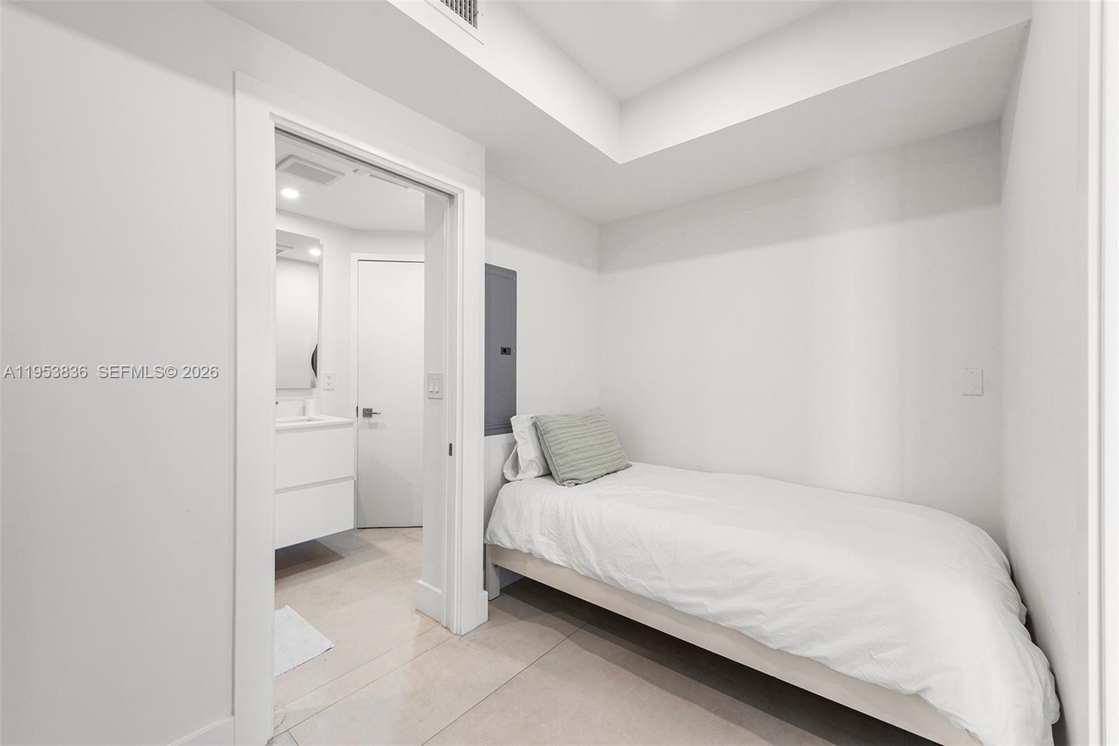 791 Crandon Boulevard, Unit 901 Key Biscayne, FL 33149 - Photo 39 of 43 a bedroom with a bed and a closet