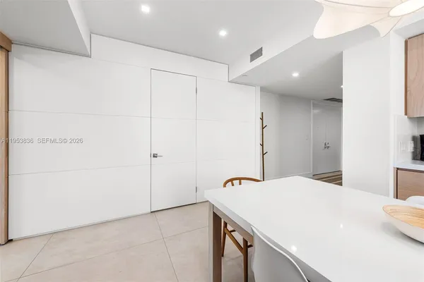 a room with a sink and cabinets