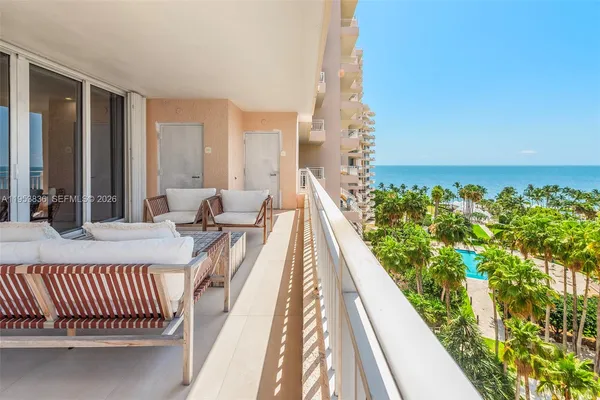 a balcony with outdoor seating