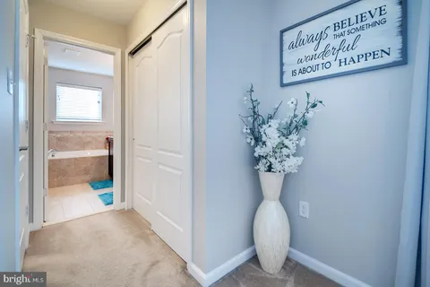 a bedroom with a large bed and a dresser