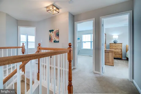 a view of a dining room with furniture and window
