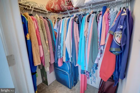a view of entryway with wooden floor and a front door
