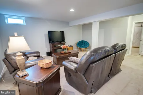a front view of a house with a yard table and chairs