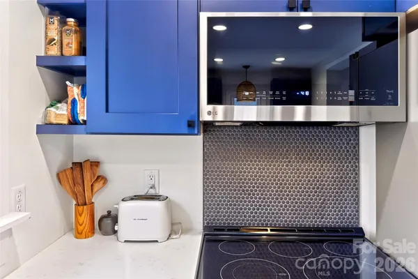 a view of kitchen and living room with furniture