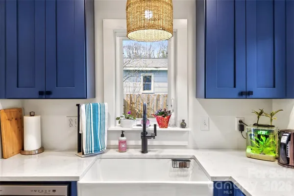 a kitchen with a sink and a microwave