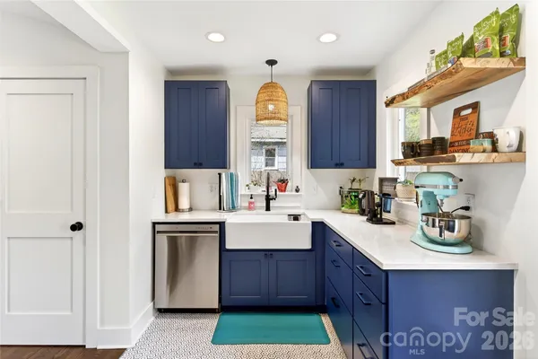 a kitchen with a sink cabinets and window