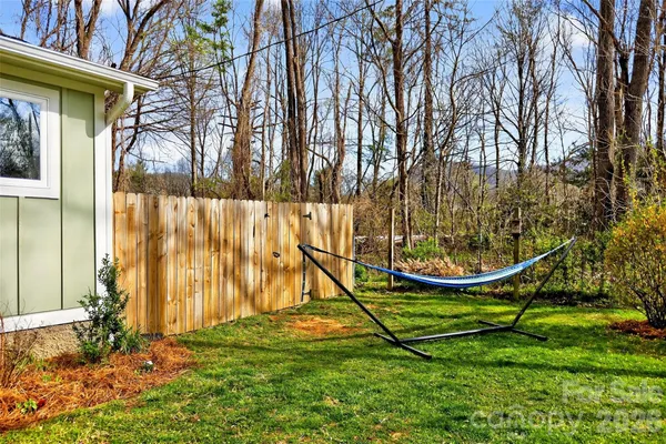 a view of swimming pool with a backyard
