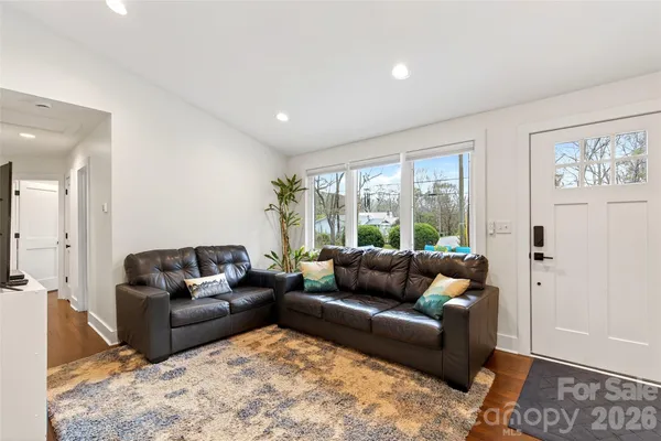 a living room with furniture and a large window
