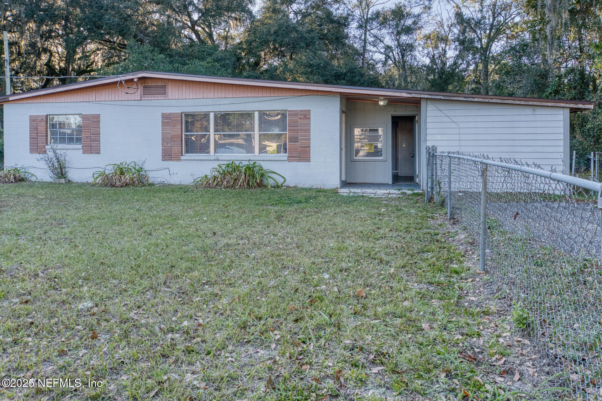 a front view of house with yard and trees