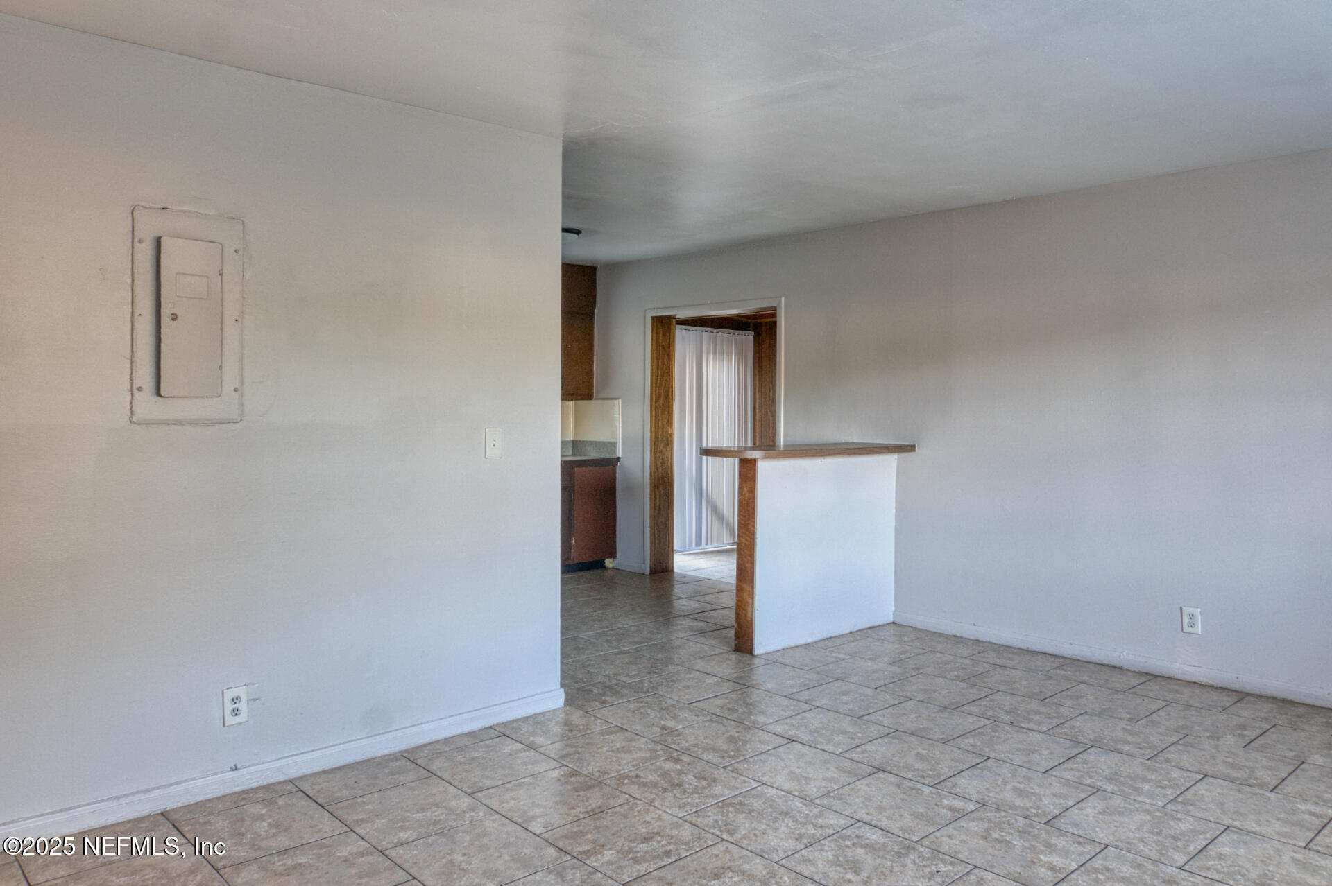 4828 Lambing Road Jacksonville, FL 32210 - Photo 16 of 31 an empty room with closet and entrance door