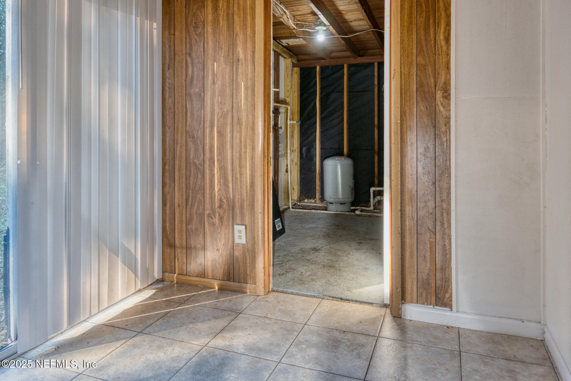 4828 Lambing Road Jacksonville, FL 32210 - Photo 26 of 31 a view of a bathroom with a glass door