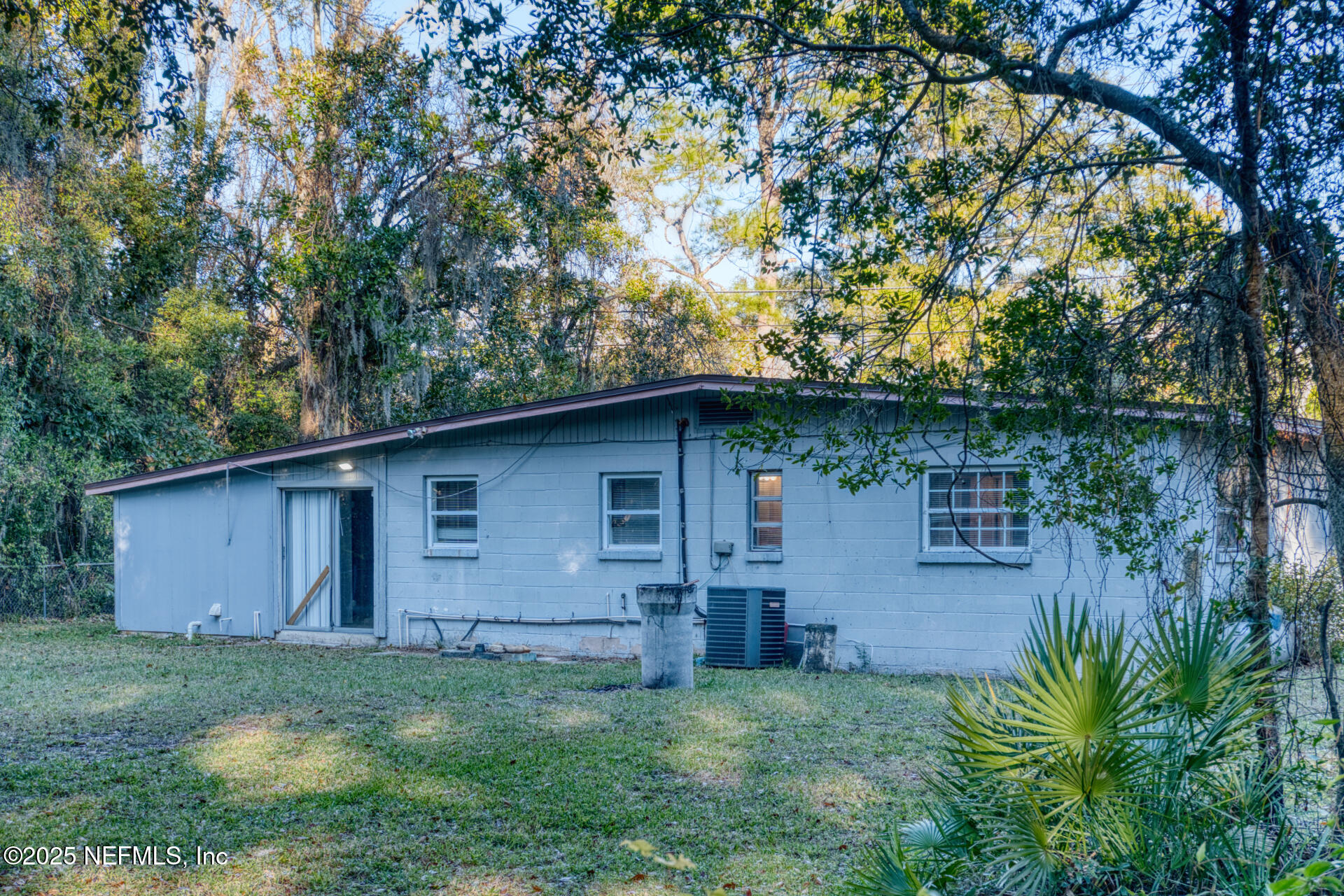 4828 Lambing Road Jacksonville, FL 32210 - Photo 29 of 31 a backyard of a house with lots of green space