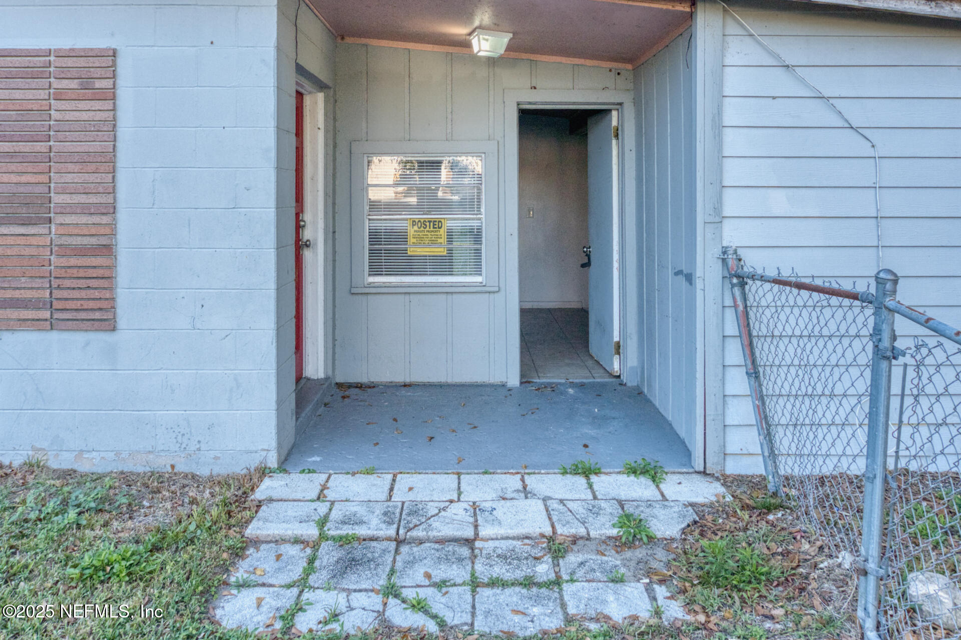 4828 Lambing Road Jacksonville, FL 32210 - Photo 4 of 31 a view of an empty room and wooden door