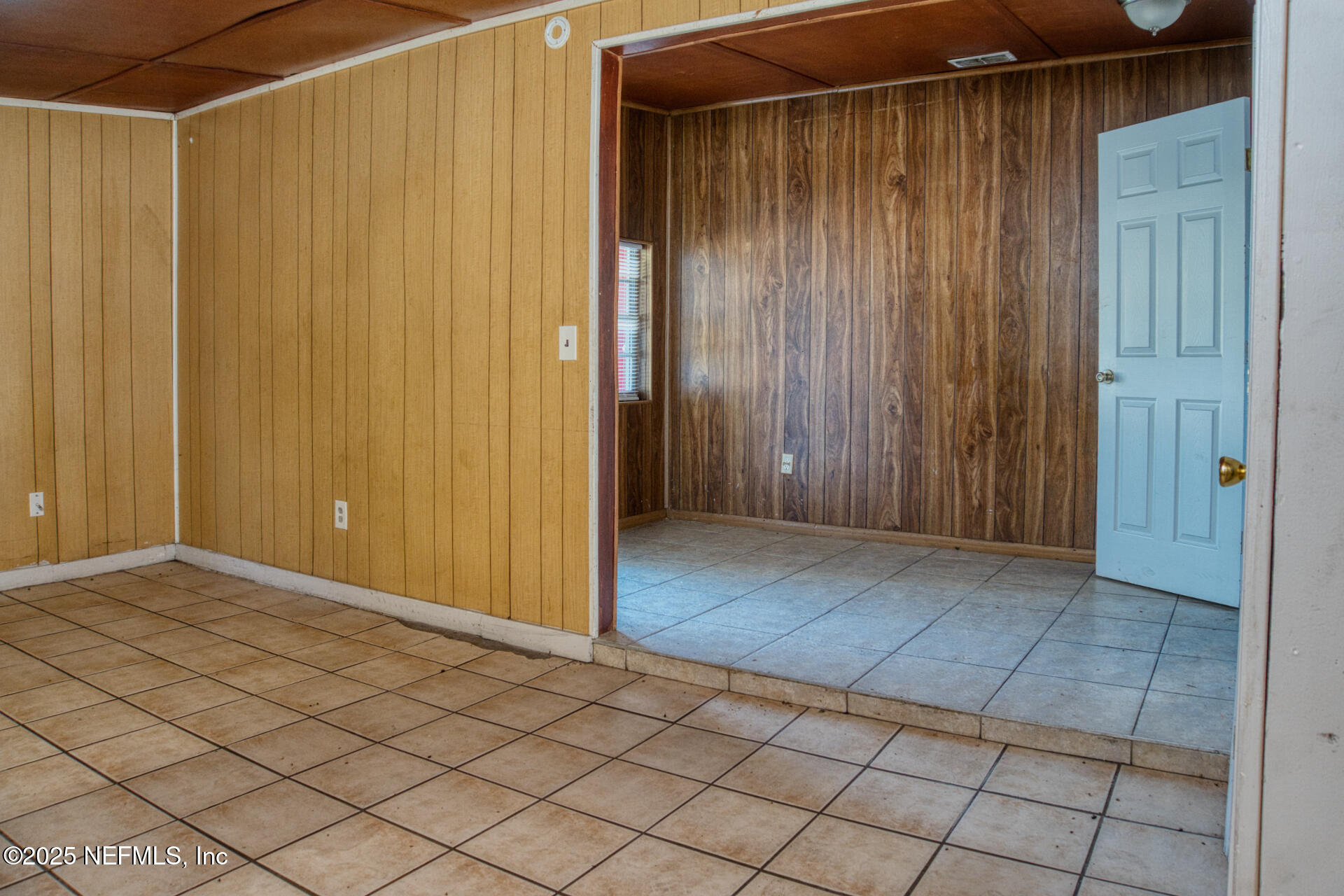 4828 Lambing Road Jacksonville, FL 32210 - Photo 8 of 31 a view of entryway with wooden walls