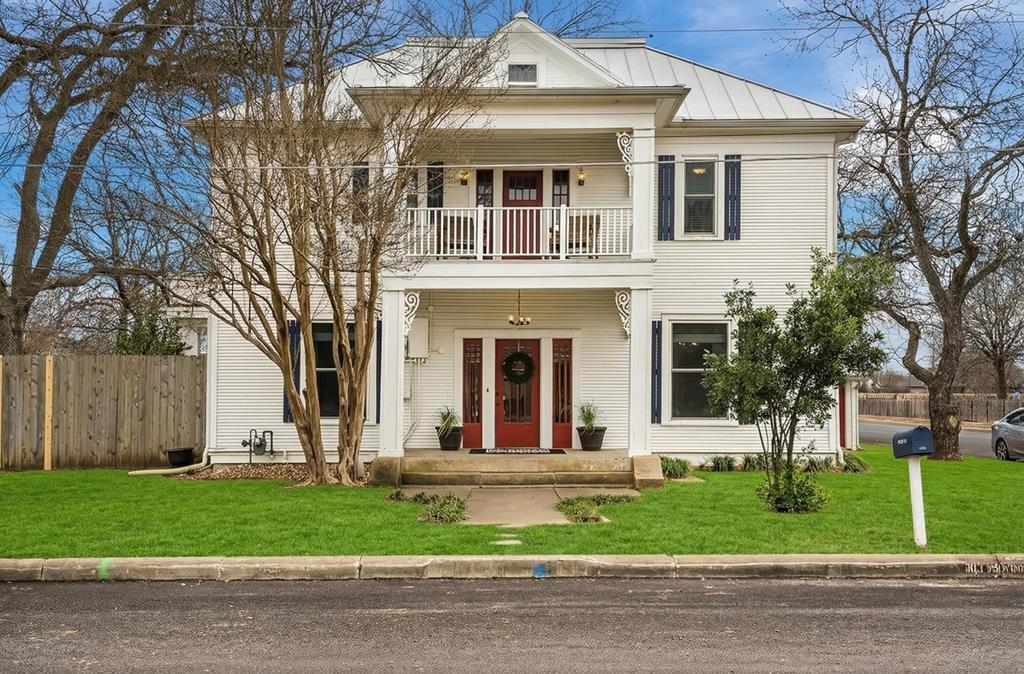 601 Bell Street Fredericksburg, TX 78624 - Photo 1 of 39 a front view of a house with a garden and plants