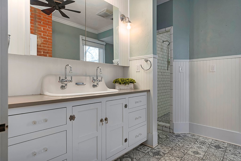 601 Bell Street Fredericksburg, TX 78624 - Photo 22 of 39 a bathroom with a sink and a mirror