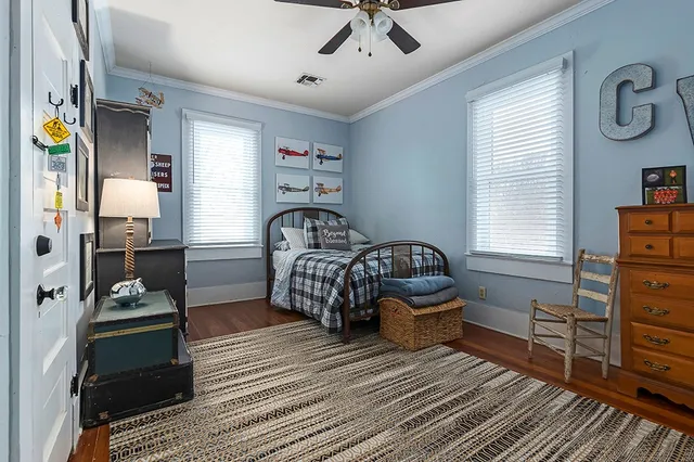 a bedroom with furniture and a window