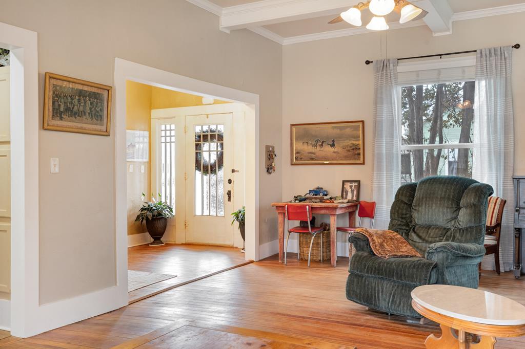 601 Bell Street Fredericksburg, TX 78624 - Photo 4 of 39 a living room with furniture and wooden floor