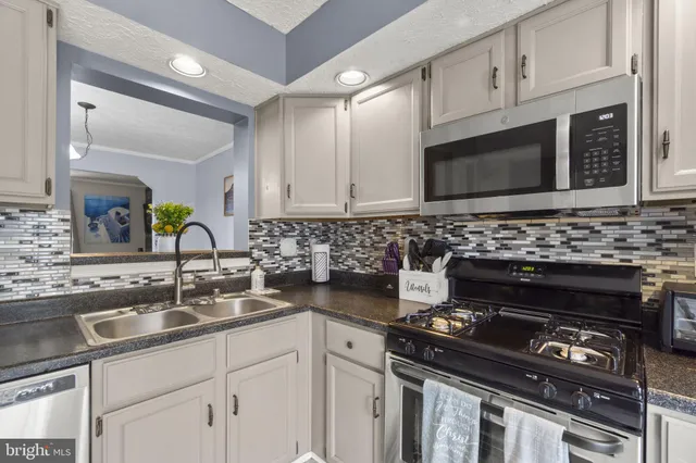 a kitchen with a stove and a sink